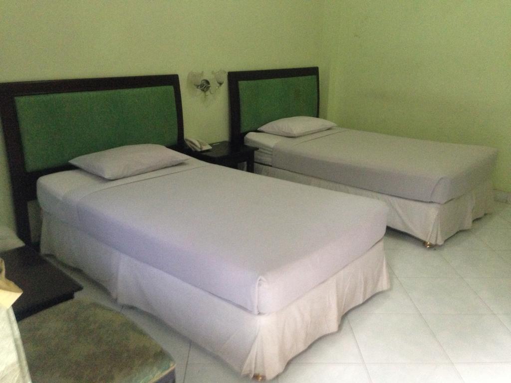 Global Inn Keluarga Sedati Zimmer foto